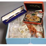 A box of assorted costume jewellery.