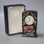 A Moorcroft pottery Anemone pattern quartz clock, height 15.5cm