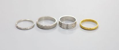 Two platinum wedding bands, 7.8 grams, an 18ct white gold wedding band, 3.7 grams and a 22ct gold