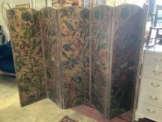 A Spanish leather folding six panel draught screen, with embossed floral printed card panels,