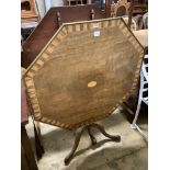 Two similar George III parquetry inlaid mahogany octagonal tilt top tables, width 96cm, height 73cm