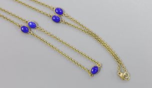 A modern 9ct gold and seven stone cabochon lapis lazuli set 'spectacle' necklace, 55cm,gross 8