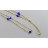 A modern 9ct gold and seven stone cabochon lapis lazuli set 'spectacle' necklace, 55cm,gross 8