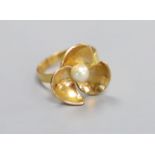 A modern 750 yellow metal and cultured pearl set dress ring, size R,gross 5.7 grams.