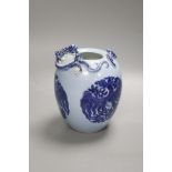 A Chinese blue ground blue and white dragon design vase, 17cm high