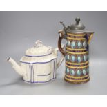 A Wedgwood majolica motto jug, 27cm high and a Regency white stoneware teapot and cover