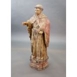 A large carved hardwood study of a standing monk or Saint, early 20th centuryWith polychrome