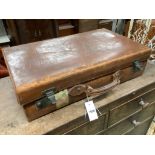 A leather case by John Pound & Co., width 60cm
