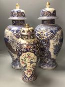 A pair of modern Chinese style lidded vases and a modern Cantonese style lidded vase, tallest 52cm