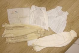 A 1920's needle run embroidered christening gown, on cream net, two whitework baby gowns and a