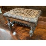 An early 20th century carved oak stool, width 29cm