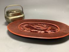 A Chinese lacquer and composition dish and a bronze hand warmer, length 27cm
