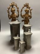 A set of five French pewter flagons and a pair of spelter lamps, height 45cm