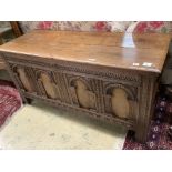 An 18th century and later oak coffer with arch panelled front, width 142cm depth 52cm height 68cm
