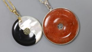 A Chinese gold-mounted black and mother of pearl Yin Yang pendant on 9ct gold chain and a silver-