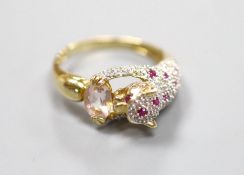 A modern Cartier style 585 yellow metal, pink topaz?, ruby and diamond encrusted leopard ring,size