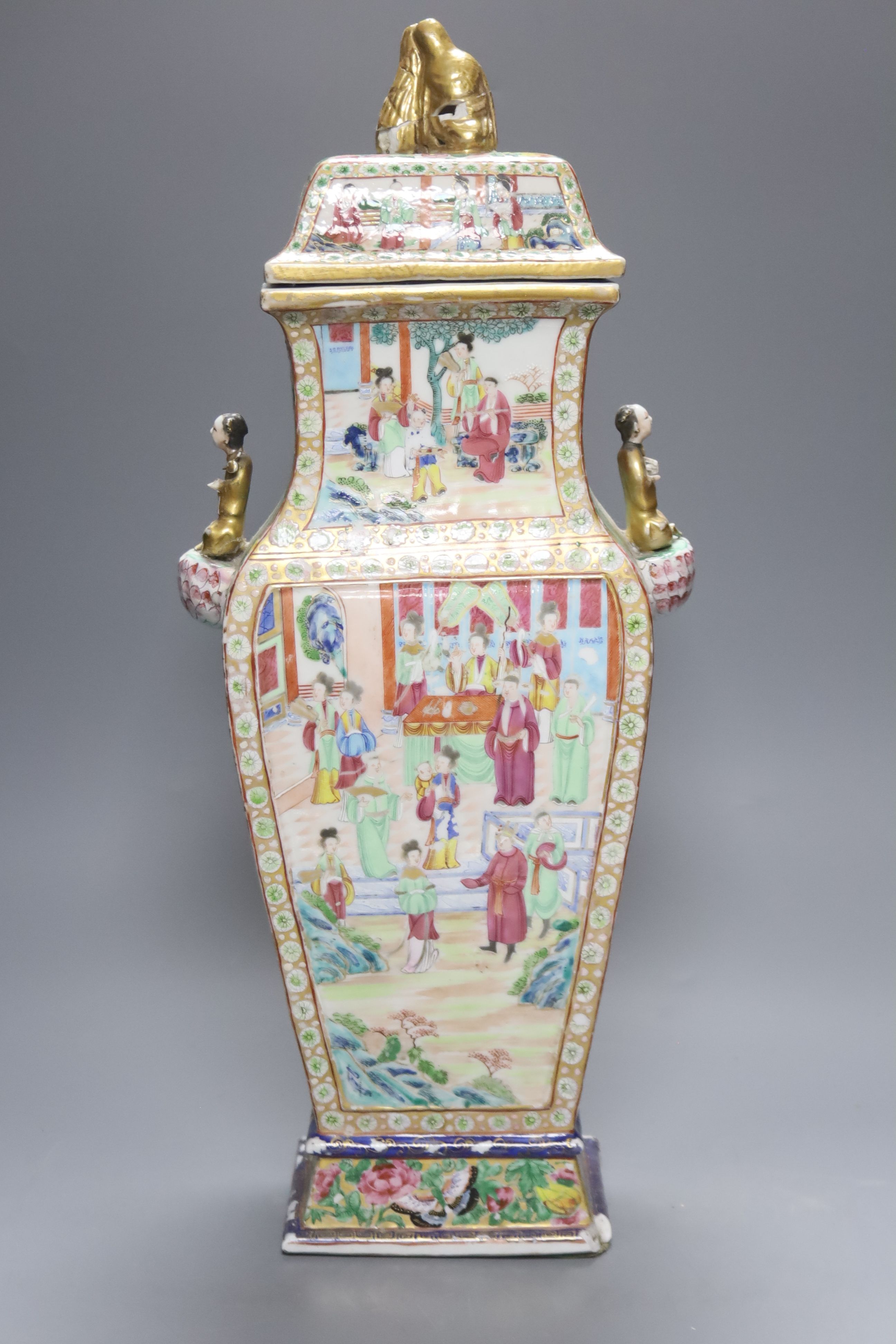 A large Chinese famille rose Canton decorated vase and cover, Daoguang period, height 53cm (a.f)