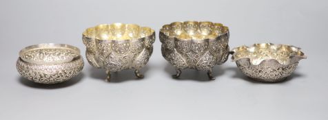 A pair of Indian white metal bowls, diameter 96mm and two similar bowls,11.5oz.