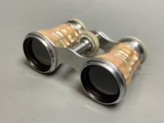A cased pair of mother of pearl opera glasses, 6cm