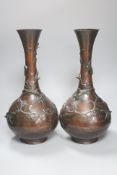 A pair of Japanese Meiji period bronze bottle vases, repaired to neck, height 46cm