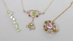 An Art Nouveau style 9ct yellow gold, peridot, pearl and ruby openwork pendant on chain and two