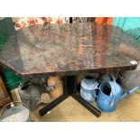 An octagonal bakelite faux marble centre table, width 116cm depth 100cm height 72cm