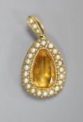 An Edwardian yellow metal, citrine and seed pearl set pear shaped pendant,overall 31mm, gross