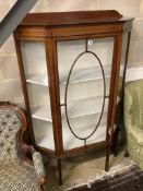 An Edwardian inlaid display cabinet fitted two shelves, width 103cm depth 37cm height 168cm