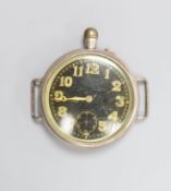 An early 20th century white metal Borgel? cased manual wind strapless wrist watch, with black dial.
