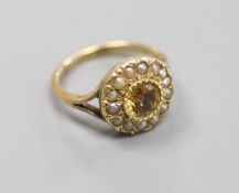 A 9ct, citrine and seed pearl set circular cluster ring,size J, gross weight 3.8 grams (a.f.)
