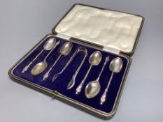 A cased set of six George V silver apostle teaspoons and a pair of sugar tongs, Cooper Brothers &