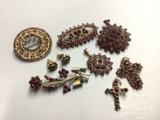 A group of facetted garnet set jewellery, including brooches, pendants and ear studs,some set in