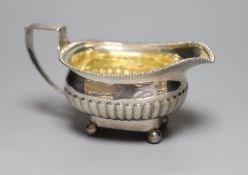 A William IV demi fluted silver cream jug, London, 1833,height 89mm, 203 grams.