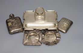 A silver shaped rectangular inkstand, fitted a silver-mounted cut glass bottle, a silver hip flask,