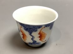 A Chinese underglaze blue and iron red 'bat' cup, height 6cm