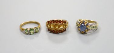 A 9ct gold cabochon sapphire and diamond ring and two other 9ct gold gem-set rings,gross 11.1