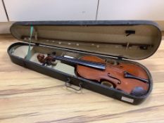 A violin and bow, in case, label to interior read Antonius Stadivarius Cremonensis, made in