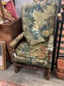 A Jacobean style carved walnut reclining armchair, with tapestry upholstery, width 68cm depth 60cm