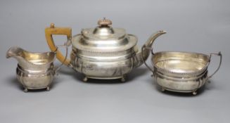 A George V three piece silver tea set, Harrod's Ltd, London, 1920/1,gross 28.5oz.