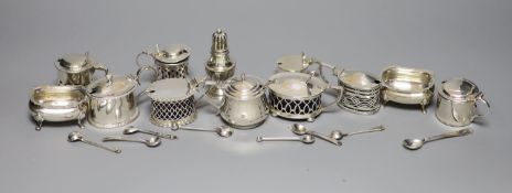 A pair of oval silver salts and spoons, nine small silver mustards, a pepper and seven various