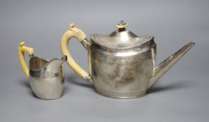 A George III silver teapot, with ivory handle, Henry Green, London, 1795 and a similar cream jug,