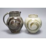 Clare Sutcliffe. A pottery jug and a similar vase, tallest 22cm