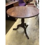 A George III oak circular tilt top tea table, diameter 75cm height 70cm