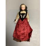A costume doll, bisque shouler plate, height 25cm