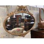 An oval gilt framed Adam design wall mirror, width 80cm height 70cm