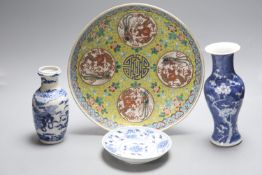 Two Chinese blue and white vases and a dish, together with a famille rose dish, tallest 28cm