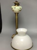 A Victorian brass and ceramic oil lamp, overall height including shade 78cm