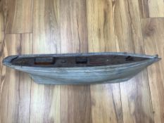 A painted model of a boat, length 76cm