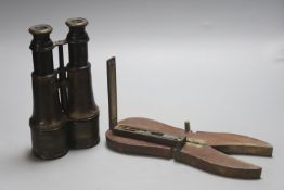 A pair of Lemaire Fab Paris bincoulars, a Georgian sovereign scale and mahogany campaign boot pulls