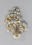 A 1950's yellow and white metal, aquamarine and diamond cluster set floral spray brooch,54mm, gross